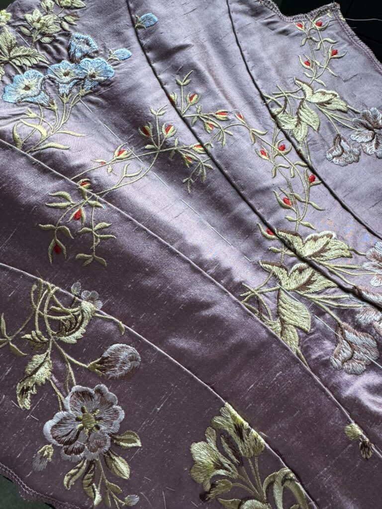 A hand-sewn silk back panel on a boned bodice for the ball scene in Wednesday
